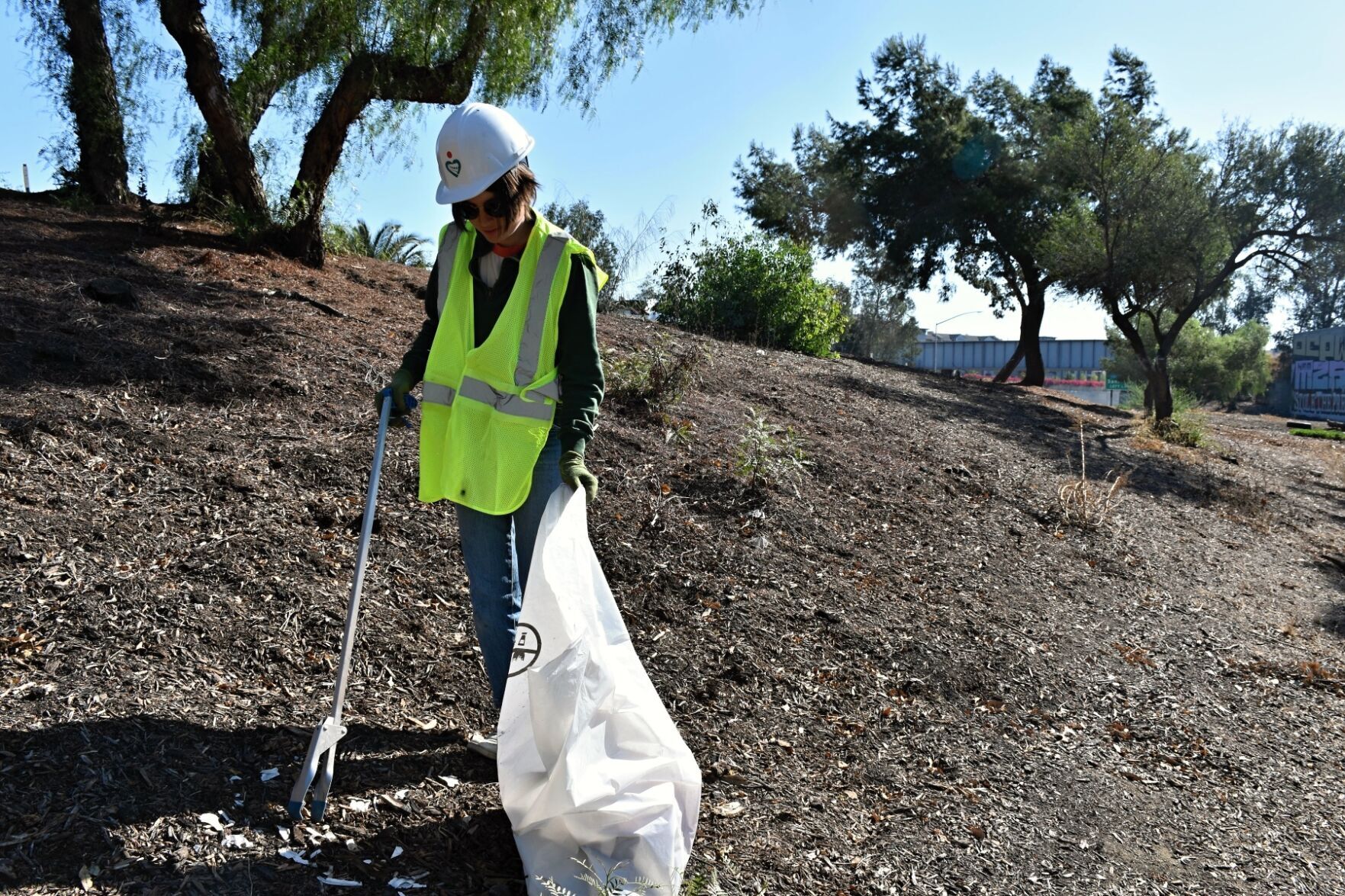 Adopt Road Volunteer Nicole Anderson, Using a Pickup Truck to Remove 600 Trash